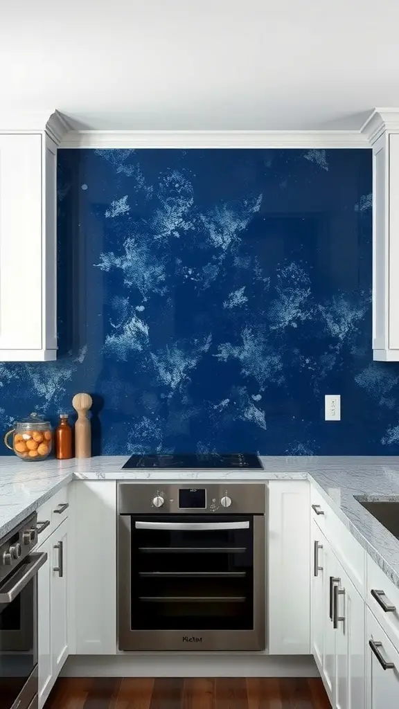 A modern kitchen featuring a navy blue splattered backsplash, white cabinets, and stainless steel appliances.