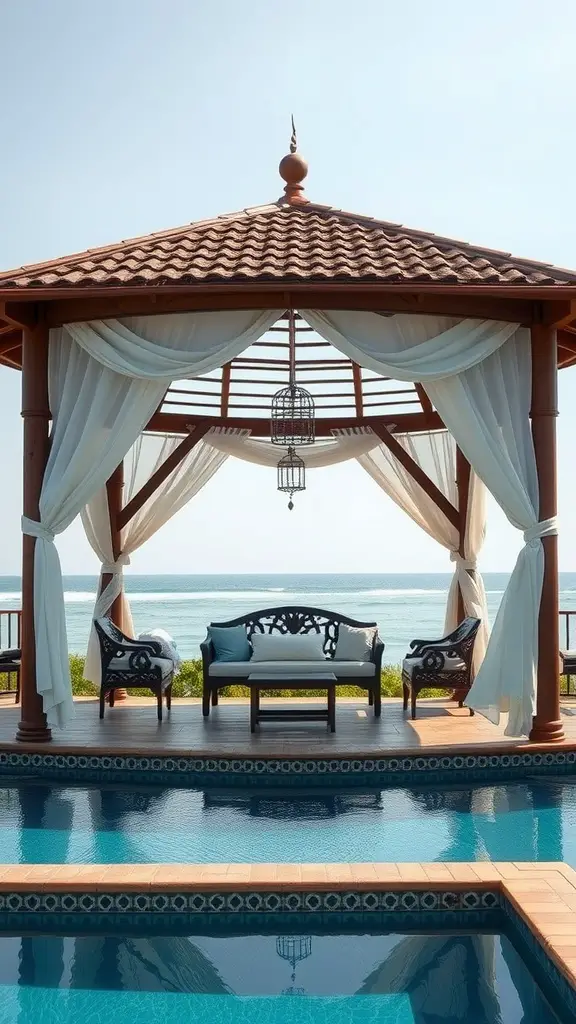 A rustic gazebo with draped fabric overlooking a swimming pool and ocean view.