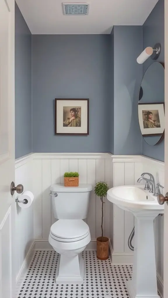 19 Stylish Small Main Bathroom Ideas to Maximize Space 17 A small bathroom featuring soft blue walls, white wainscoting, a round mirror, and stylish decor.