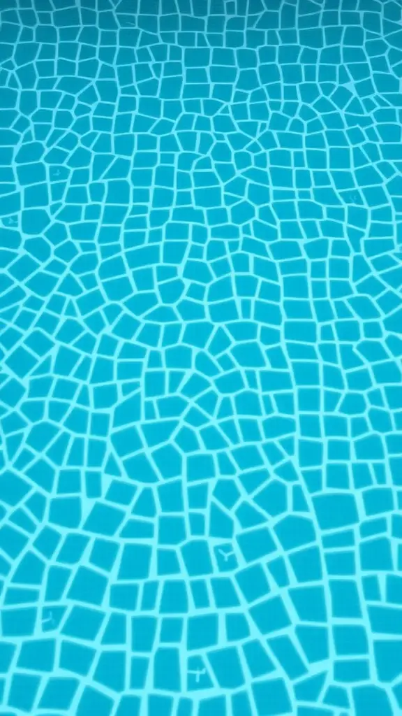 13 Stunning Pool Tile Ideas for Your Outdoor Oasis 7 Textured blue pool tiles creating a unique pattern, showcasing their grip for safety.