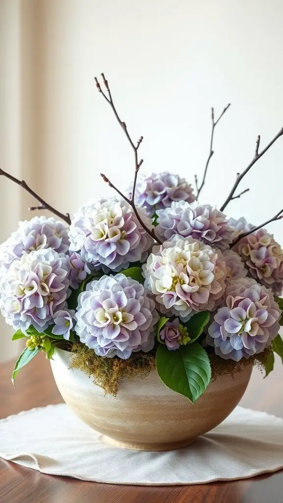A beautiful hydrangea bouquet in a textured bowl, featuring soft purple and white blooms, accented with twig branches.