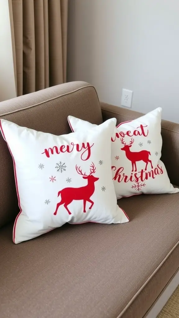 Two festive pillow covers on a couch, one says 'Merry Christmas' and the other 'Sweet Christmas' with reindeer designs.