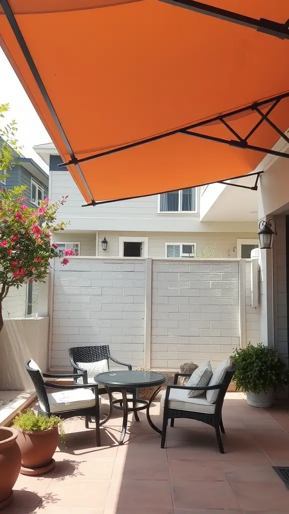 29 Creative Small Patio Decorating Ideas You’ll Love 15 A small patio with an orange shade canopy, featuring a table and chairs surrounded by potted plants.