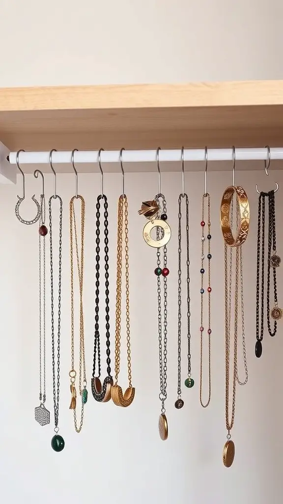 Necklaces hanging from a rod under a shelf, showcasing organized jewelry storage.