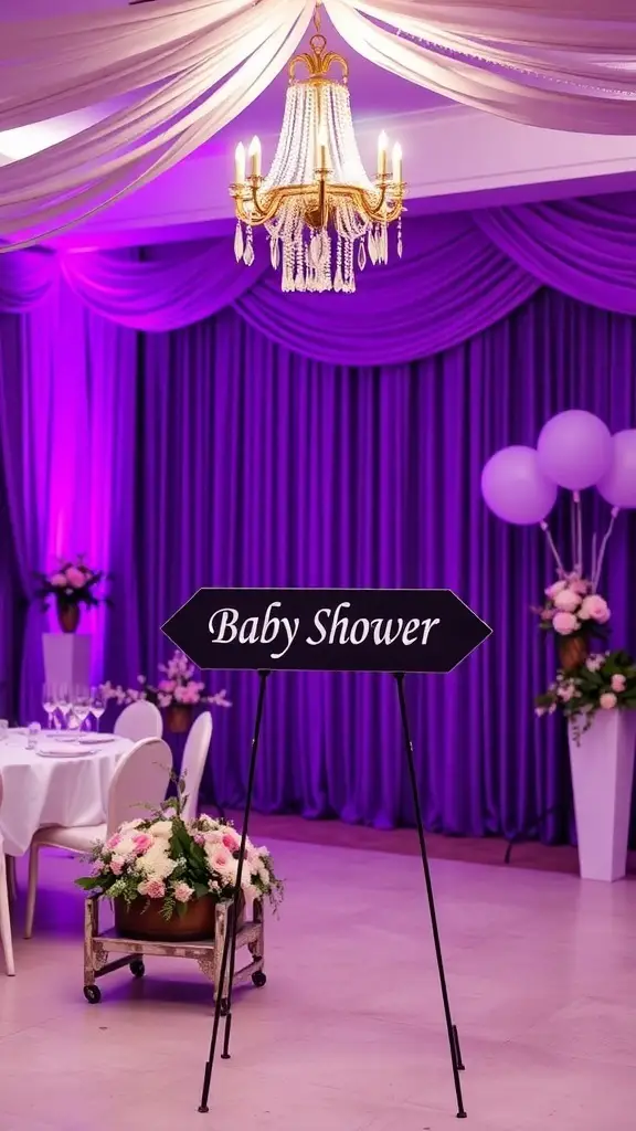 15+ Gorgeous Purple Baby Shower Ideas for a Magical Celebration 11 A black 'Baby Shower' sign in front of purple drapery and floral arrangements.