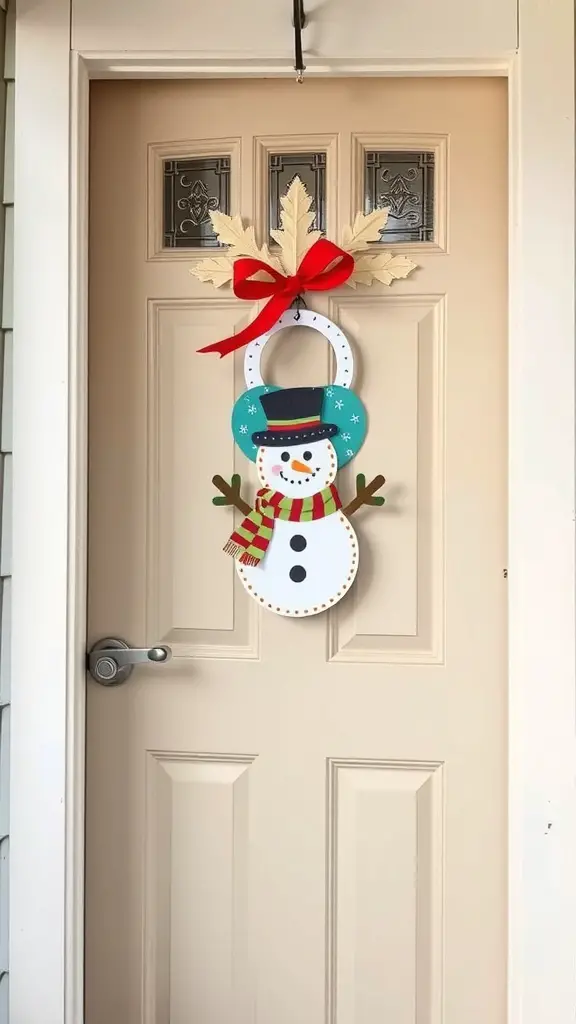 A cheerful snowman door hanger with a blue hat and red scarf, adorned with a red bow and festive leaves.
