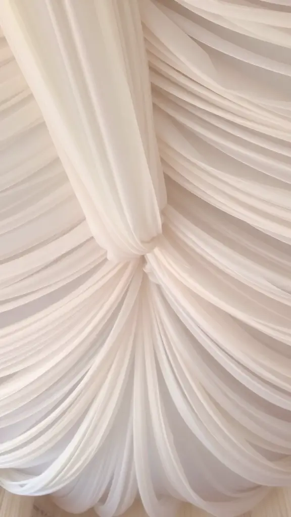 27+ Stunning Fall Ceiling Designs to Inspire Your Home Decor 15 A soft, draped fabric ceiling in light colors, showcasing elegant folds.