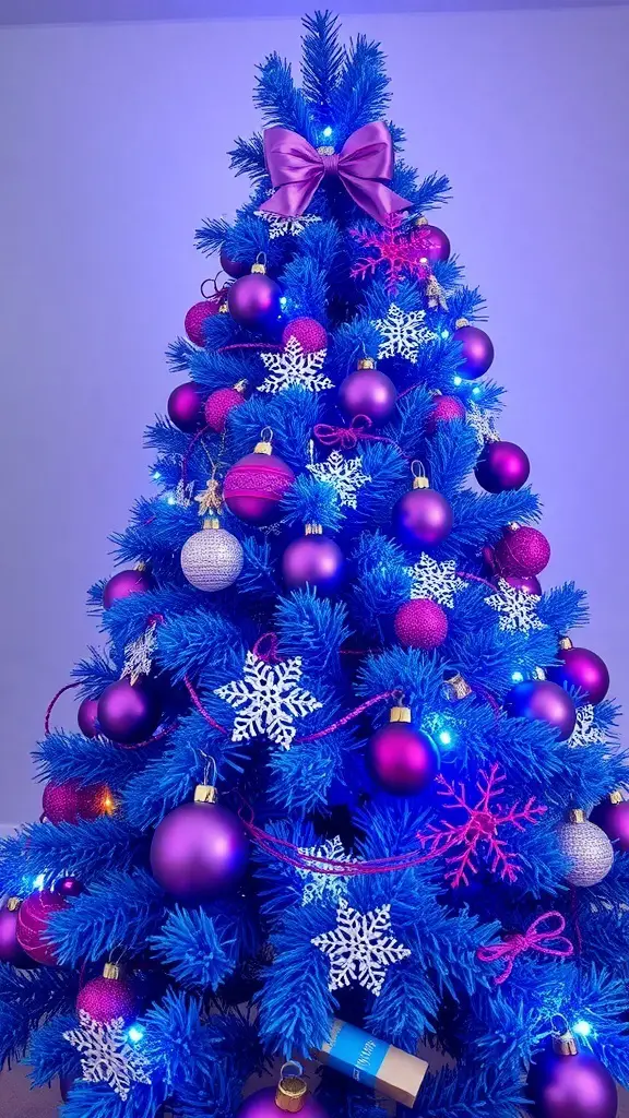 A blue Christmas tree decorated with purple ornaments and snowflakes.