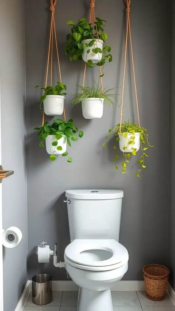 27+ Stylish Over the Toilet Storage Ideas to Maximize Your Space 15 Hanging planters with green plants in white pots above a toilet in a modern bathroom.