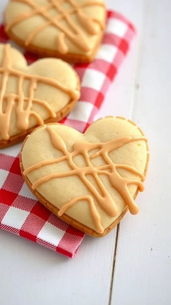 Heart-shaped peanut butter cookies with icing on a checkered napkin