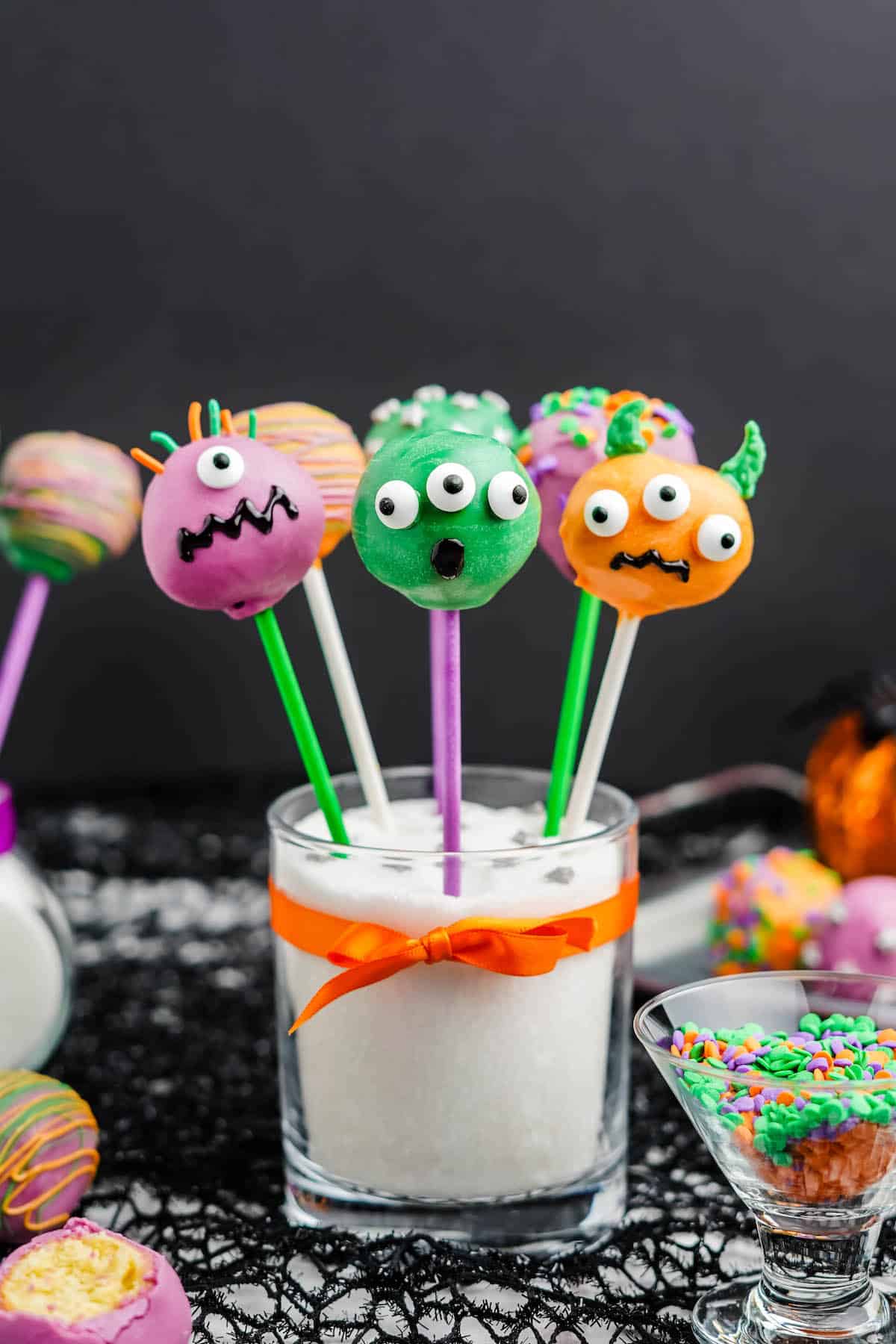 27 Halloween Treats for Kids and Adults That Everyone Will Love 8 Colorful monster cake pops with candy eyes