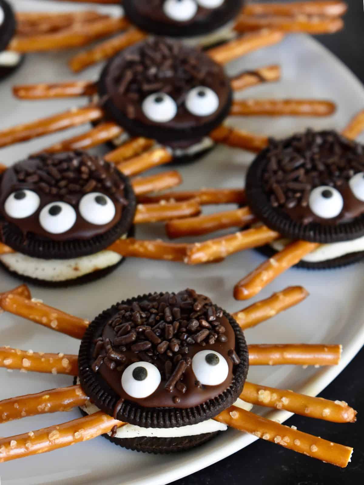 27 Halloween Treats for Kids and Adults That Everyone Will Love 10 Oreo spider cookies with pretzel legs and candy eyes