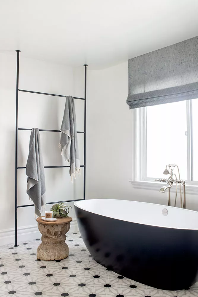 29+ Bathroom Towel Storage Ideas for a Clean and Organized Space 14 Floor to Ceiling Metal Towel Ladder