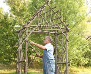25 DIY Garden Art Sculptures to Add Personality to Your Yard 15 Rustic Twig Arbor Structure