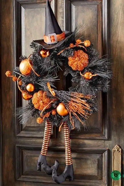 27 Halloween Wreath Ideas to Give Your Front Door a Spooky Touch 7 Witch Legs Pine Wreath