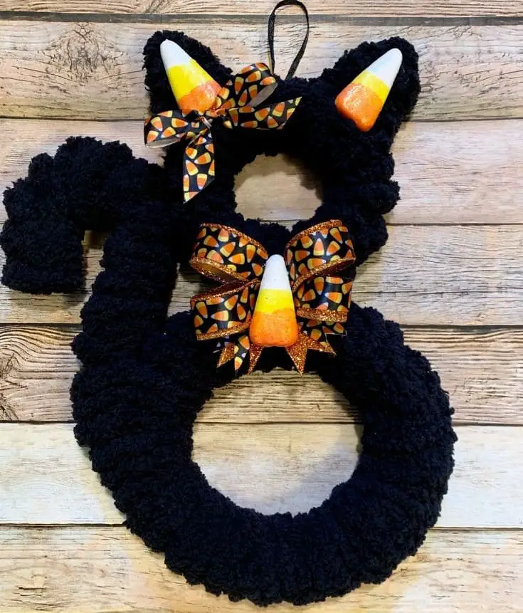 27 Halloween Wreath Ideas to Give Your Front Door a Spooky Touch 15 Black Cat Candy Corn Wreath