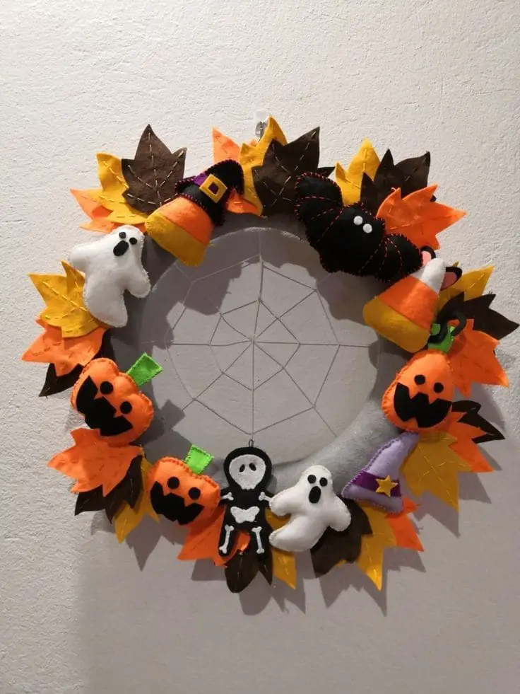 27 Halloween Wreath Ideas to Give Your Front Door a Spooky Touch 21 Felt Halloween Friends Wreath