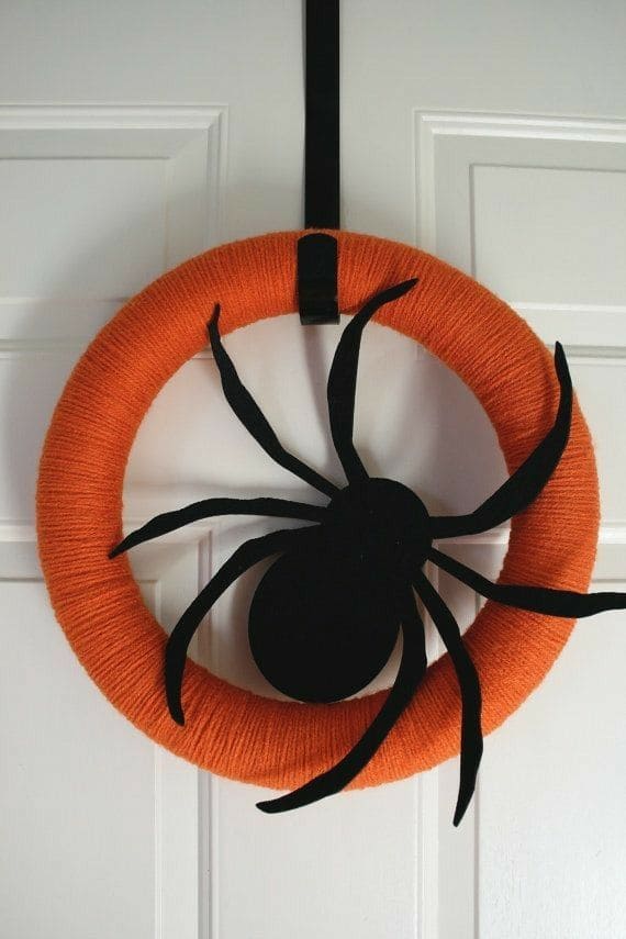 27 Halloween Wreath Ideas to Give Your Front Door a Spooky Touch 22 Minimalist Spider Yarn Wreath