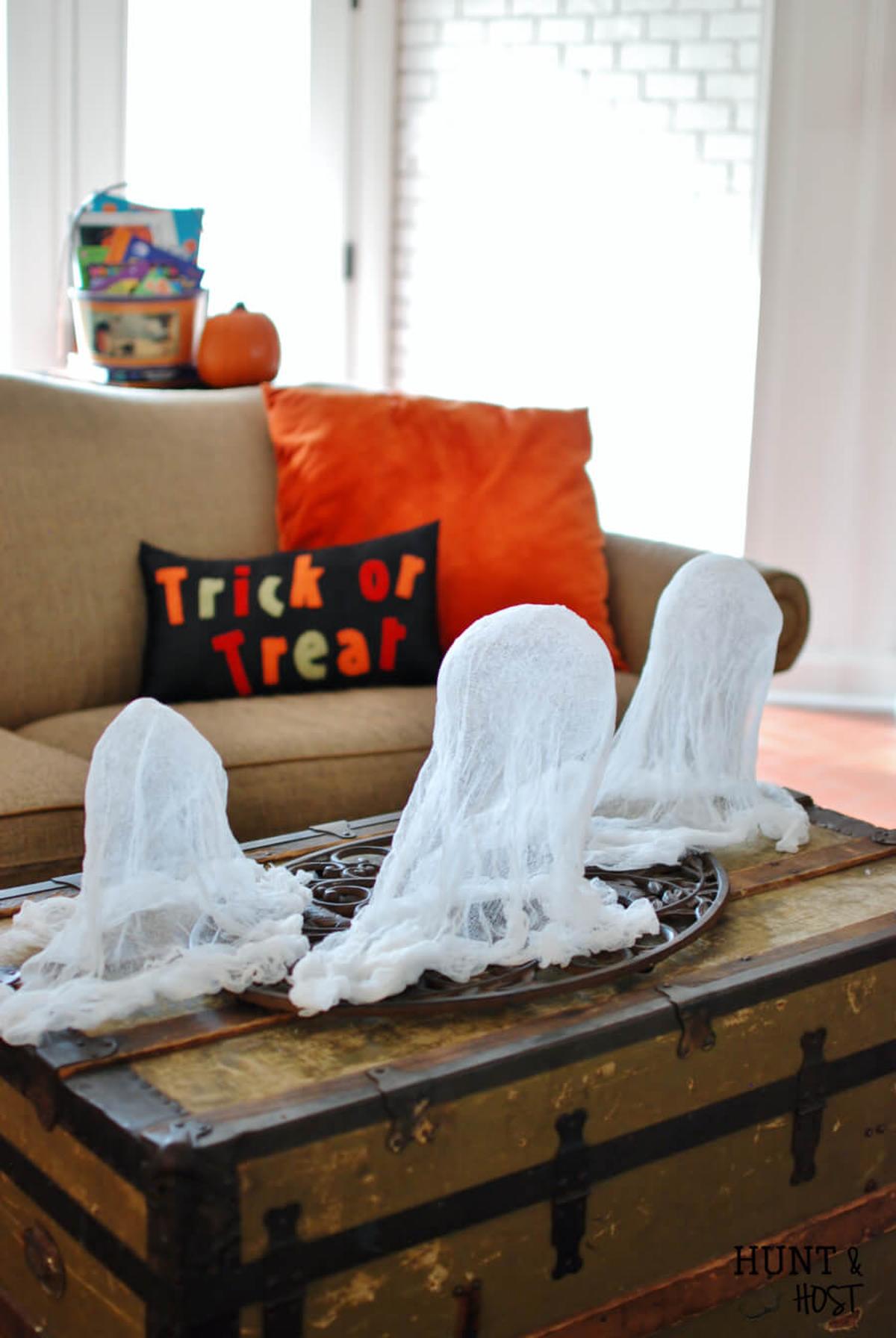 31 Indoor Halloween Decorations Ideas to Make Your Home Spooktacular 4 Cheesecloth Tabletop Ghosts