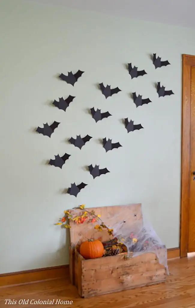 31 Indoor Halloween Decorations Ideas to Make Your Home Spooktacular 6 Wall Bat Swarm Decor