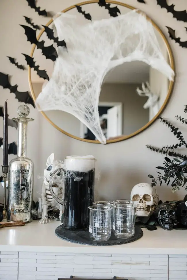 31 Indoor Halloween Decorations Ideas to Make Your Home Spooktacular 22 Mad Scientist Potion Bar Setup
