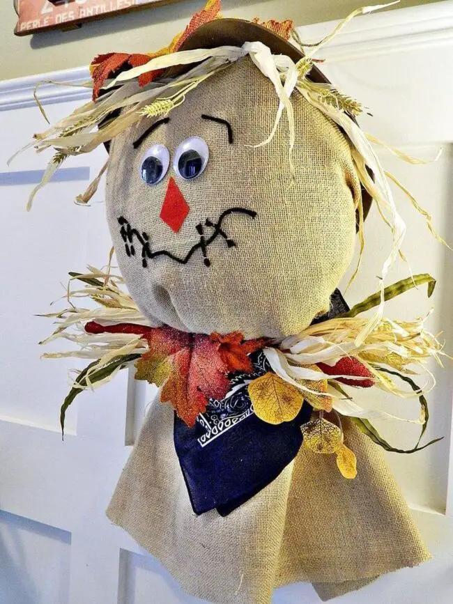 31 Indoor Halloween Decorations Ideas to Make Your Home Spooktacular 23 Burlap Scarecrow Door Hanger