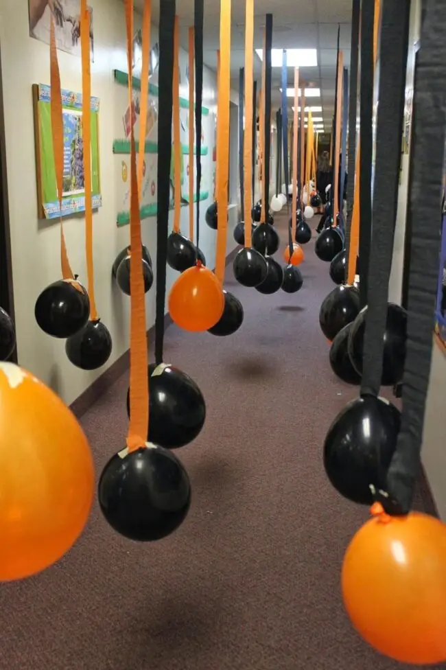 31 Indoor Halloween Decorations Ideas to Make Your Home Spooktacular 30 Hanging Balloon Hallway Canopy