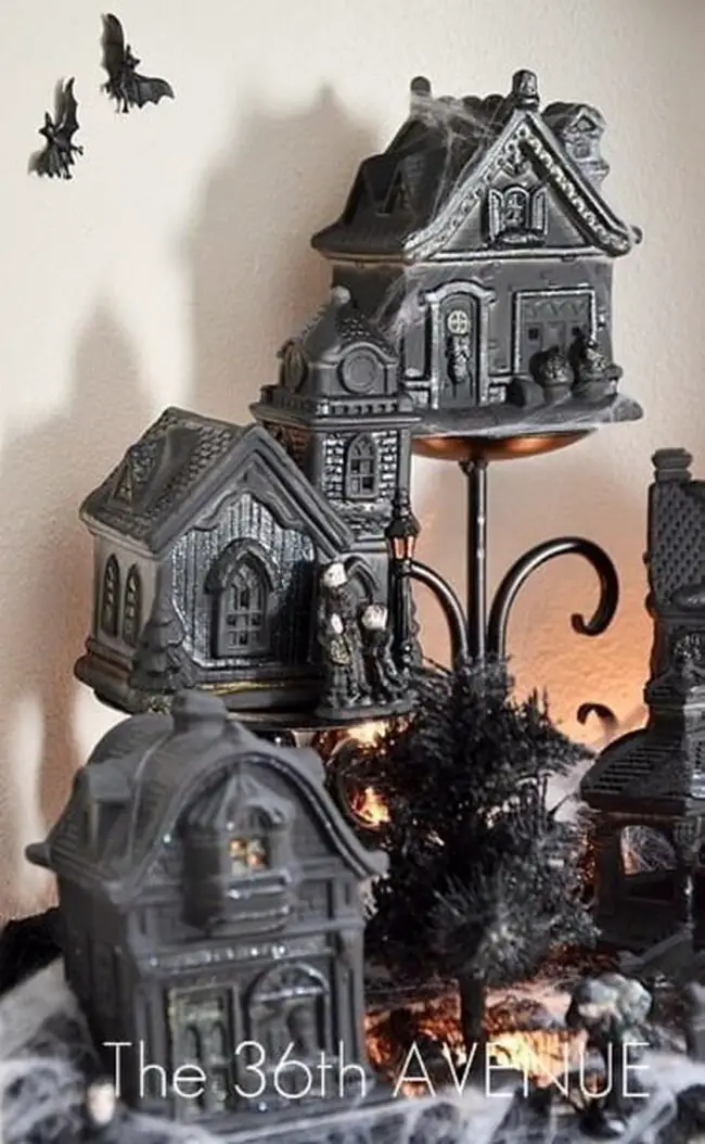 31 Indoor Halloween Decorations Ideas to Make Your Home Spooktacular 31 Haunted Village Tiered Display