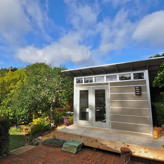 31 Tiny Shed House Ideas for Small and Creative Living Spaces 3 Modern Studio Shed with Wooden Deck