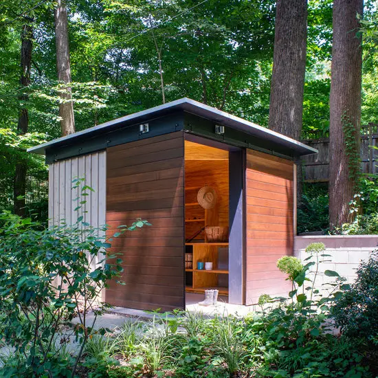 31 Tiny Shed House Ideas for Small and Creative Living Spaces 8 Wood Sided Garden Shed with Sliding Doors