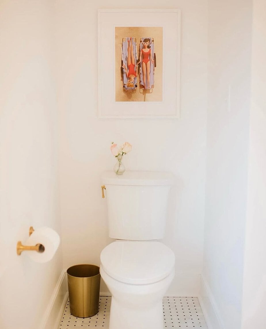 25 Small Toilet Room Ideas to Make a Tiny Space Feel Stylish 6 Playful Retro Wall Art with Brass Accents