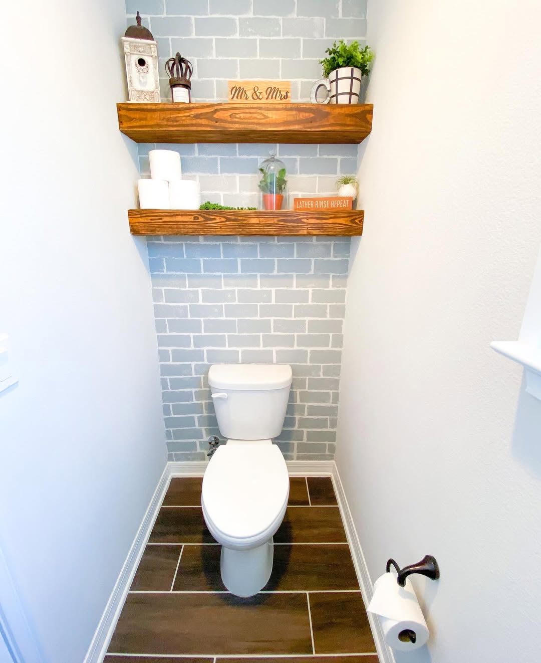 25 Small Toilet Room Ideas to Make a Tiny Space Feel Stylish 9 Exposed Faux Brick Wall with Natural Wood Shelves