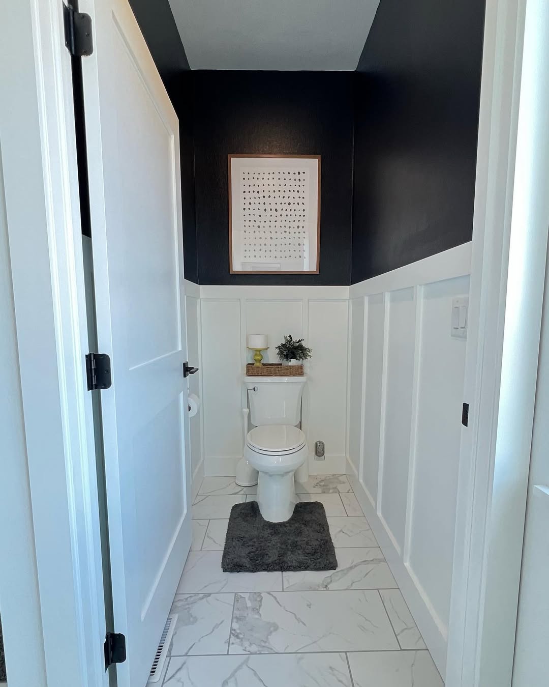 25 Small Toilet Room Ideas to Make a Tiny Space Feel Stylish 11 High-Contrast Black and White Panel Design