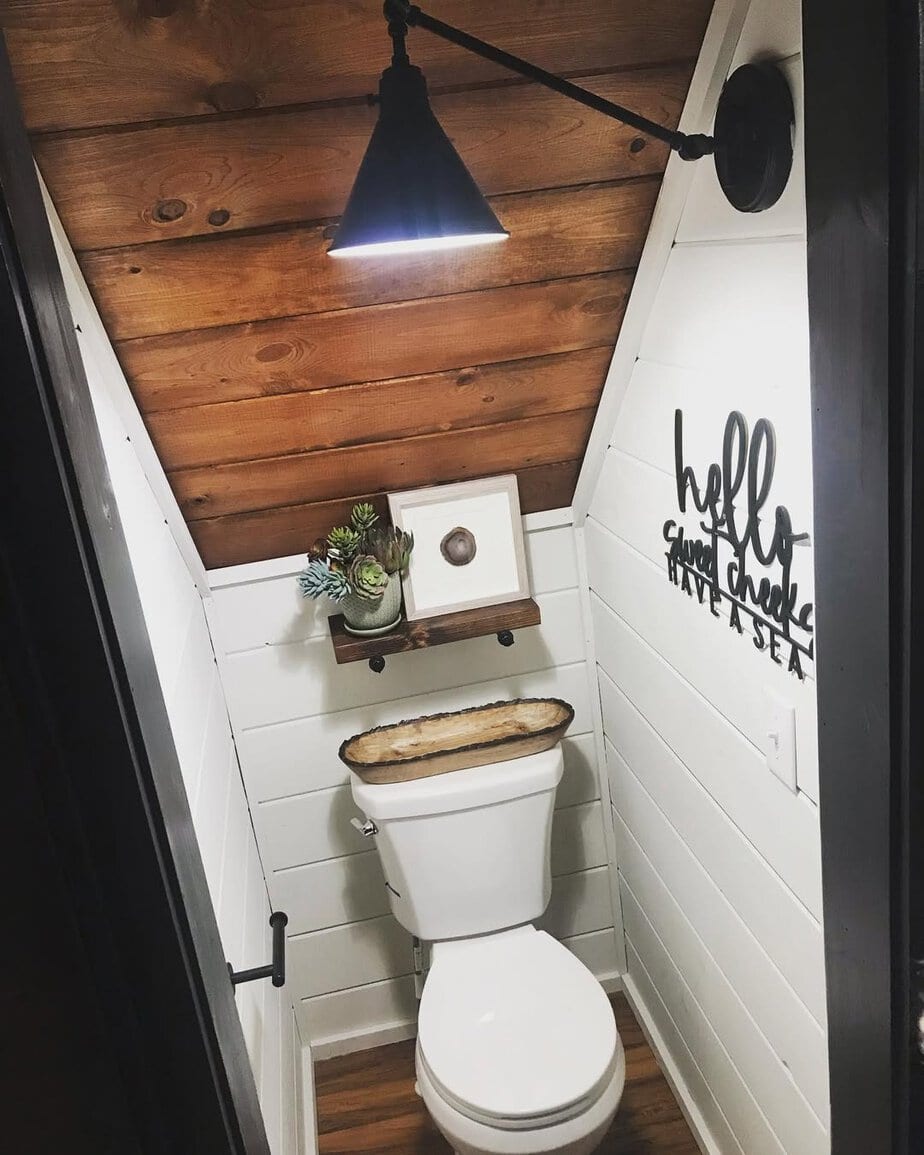 25 Small Toilet Room Ideas to Make a Tiny Space Feel Stylish 15 Slanted Wood Ceiling with White Shiplap