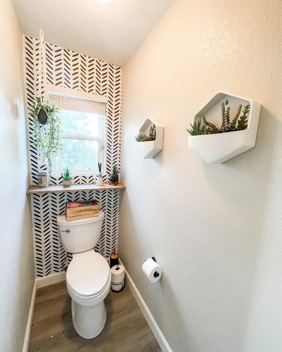 25 Small Toilet Room Ideas to Make a Tiny Space Feel Stylish 19 Herringbone Accent Wall with Wall Mounted Planters