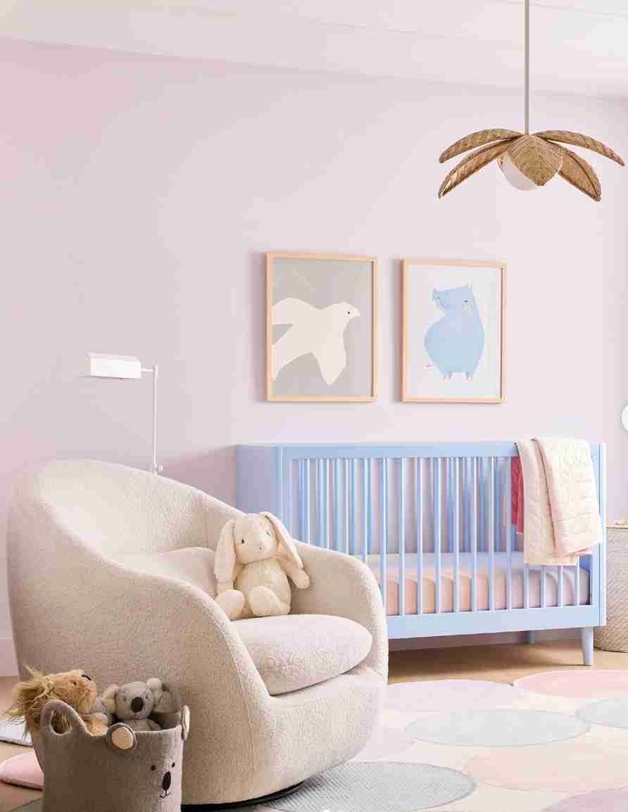 25 Toddler Boy Bedroom Ideas for a Fun and Functional Space 5 Soft Pastel Nursery with Curved Armchair