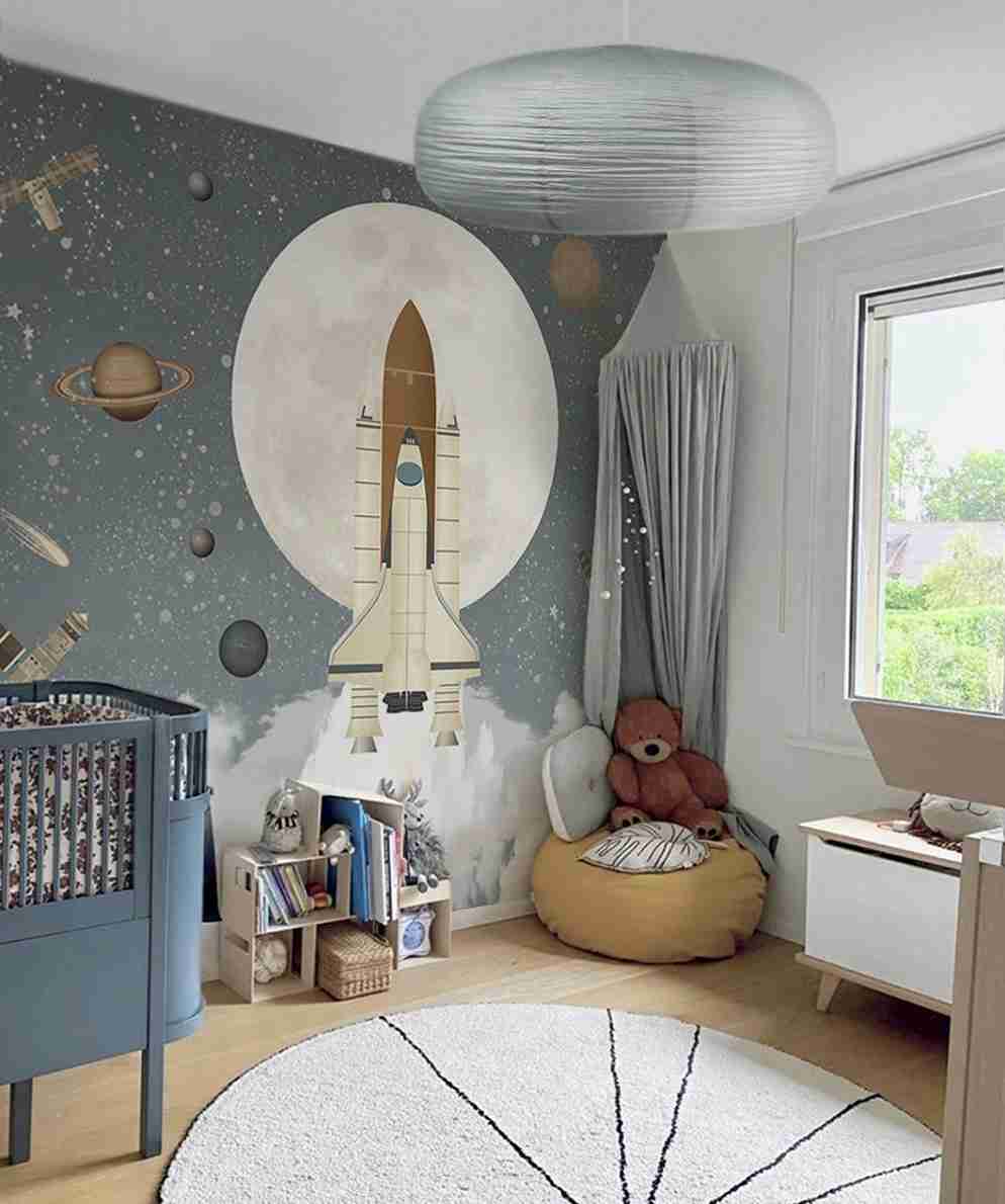 25 Toddler Boy Bedroom Ideas for a Fun and Functional Space 15 Rocket Launch Wallpaper with Oval Storage Crib