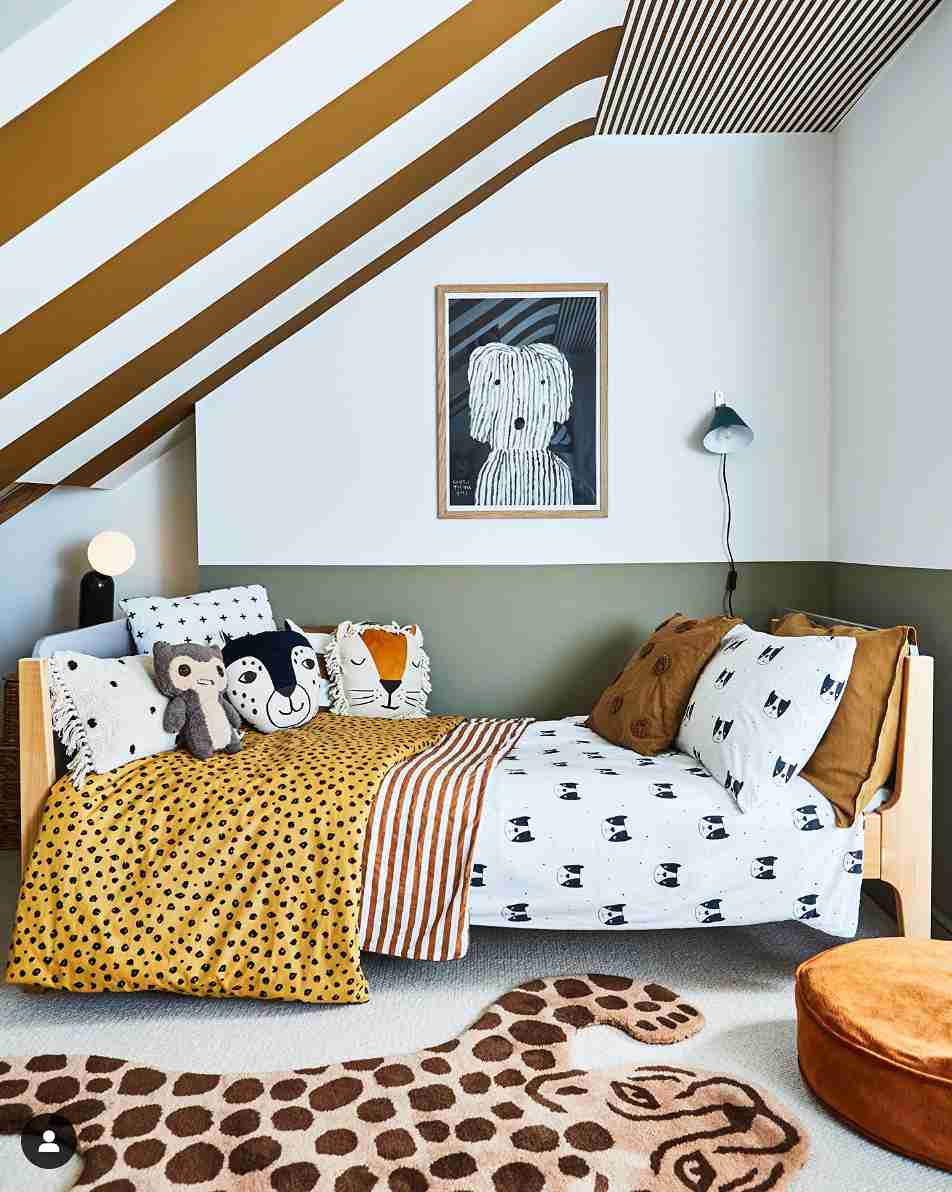 25 Toddler Boy Bedroom Ideas for a Fun and Functional Space 16 Leopard Print Accent Decor with Sloped Ceiling