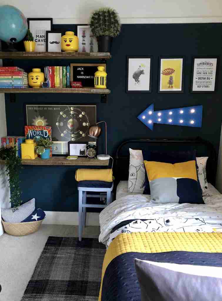 25 Toddler Boy Bedroom Ideas for a Fun and Functional Space 26 Dark Navy Accent Wall with Superhero Decor
