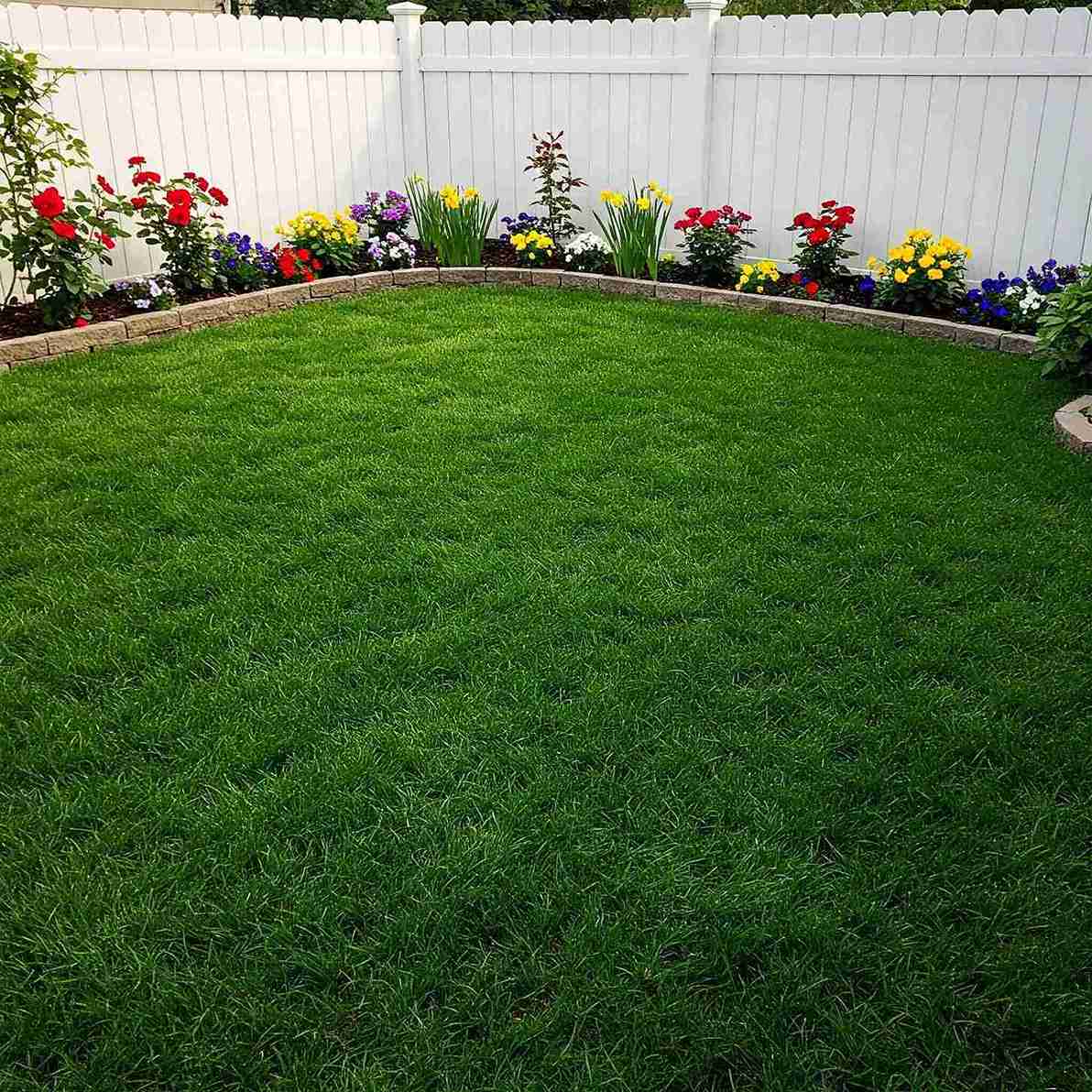 17+ Turf Backyard Ideas That Look Beautiful and Low-Maintenance 7 Illuminated Paver Path and Built In Fire Pit Bench