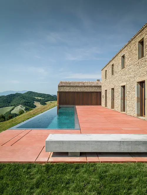Cliffside Infinity Pool with Red Terracotta Deck