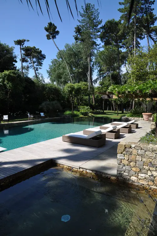 Forested Resort Style Pool and Stone Deck