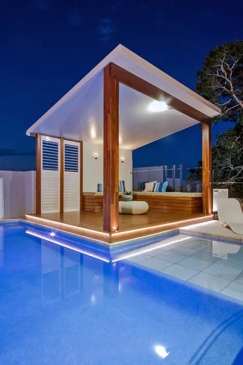 Night Lit Pool Cabana with Timber Beams