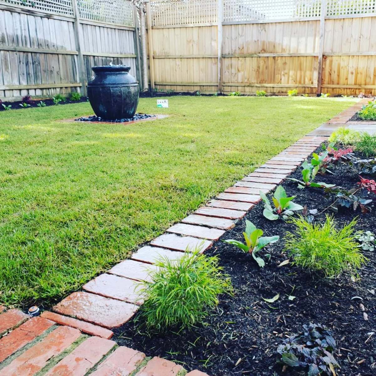 29 Brick Landscaping Ideas to Give Your Yard Timeless Charm 5 Flush Red Brick Trim
