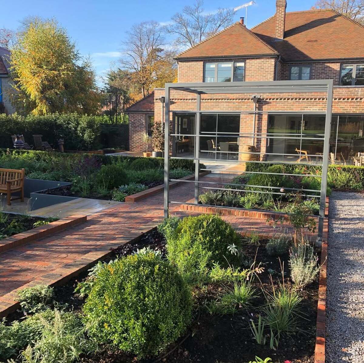 29 Brick Landscaping Ideas to Give Your Yard Timeless Charm 8 Red Brick Walkway and Border