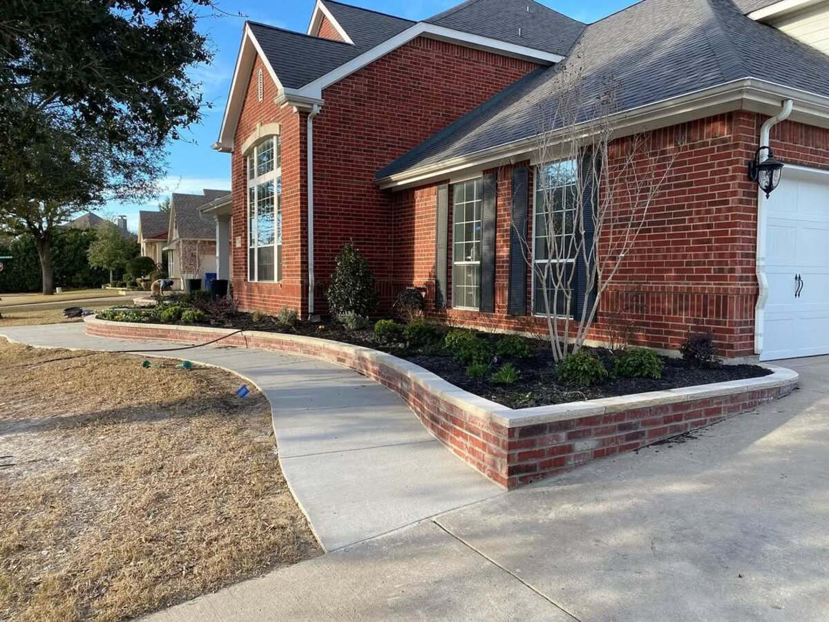 29 Brick Landscaping Ideas to Give Your Yard Timeless Charm 12 Raised Brick Retaining Wall Bed