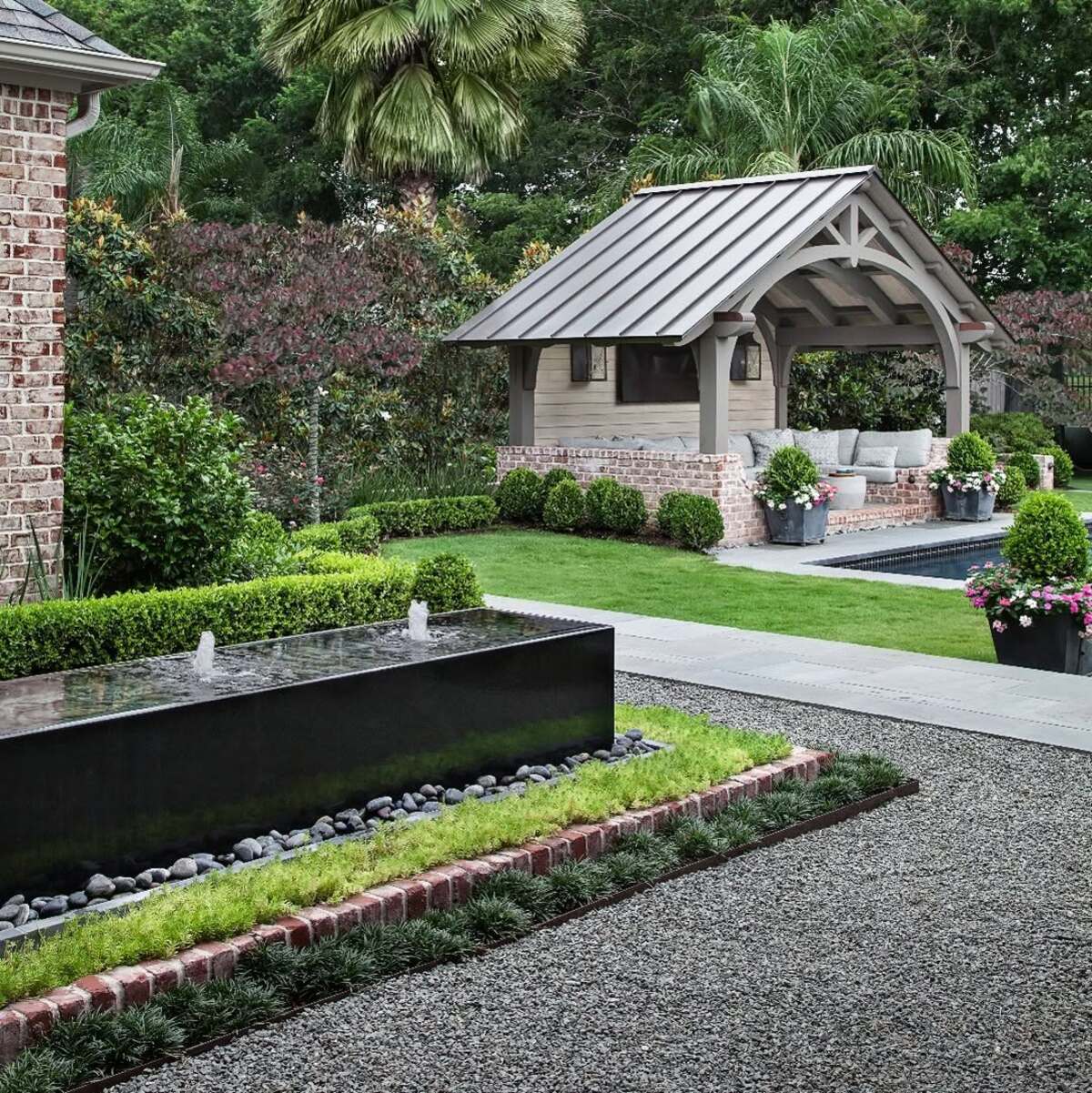 29 Brick Landscaping Ideas to Give Your Yard Timeless Charm 16 Low Brick Border with Modern Water Feature