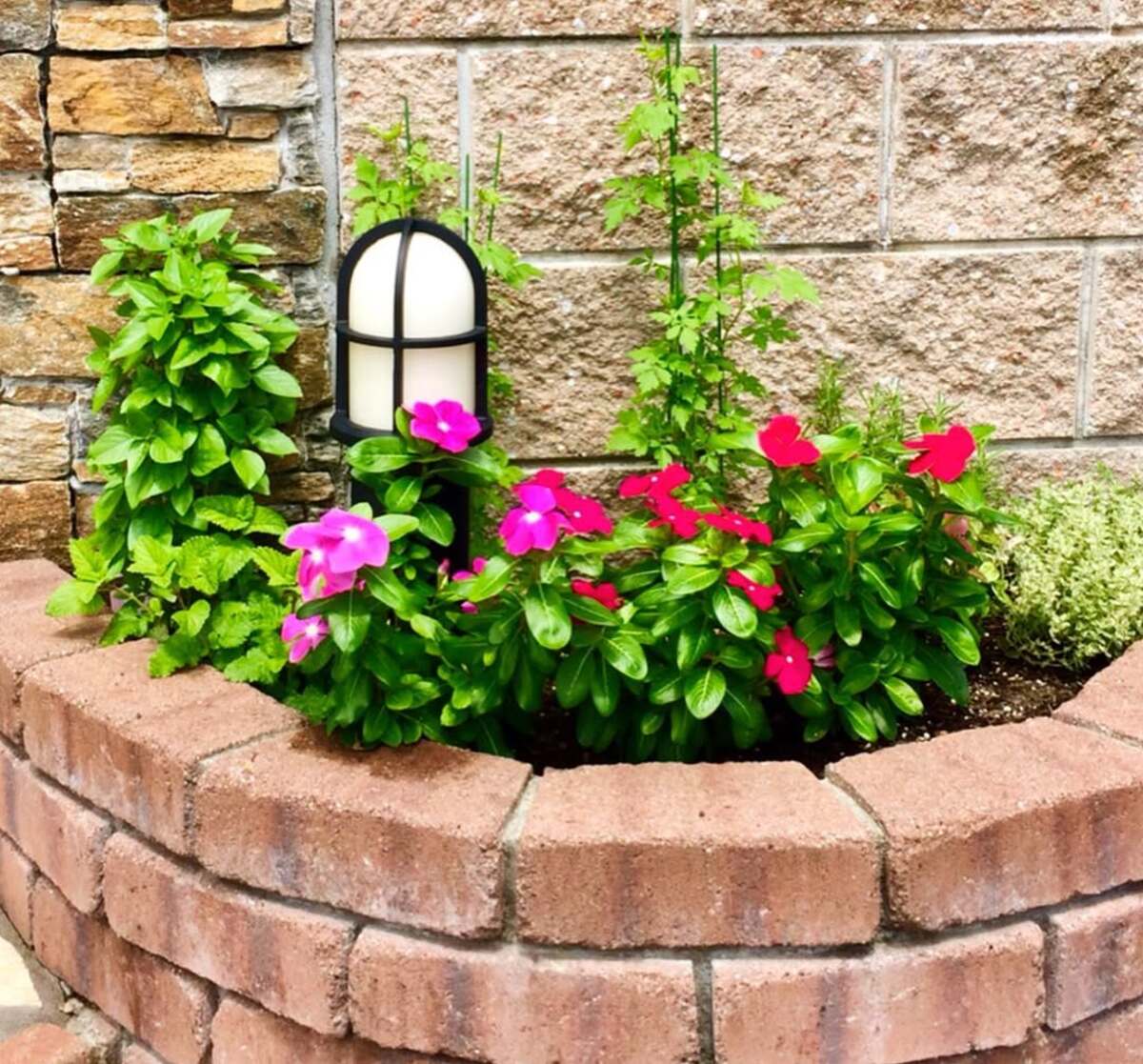 29 Brick Landscaping Ideas to Give Your Yard Timeless Charm 17 Curved Brick Raised Planter