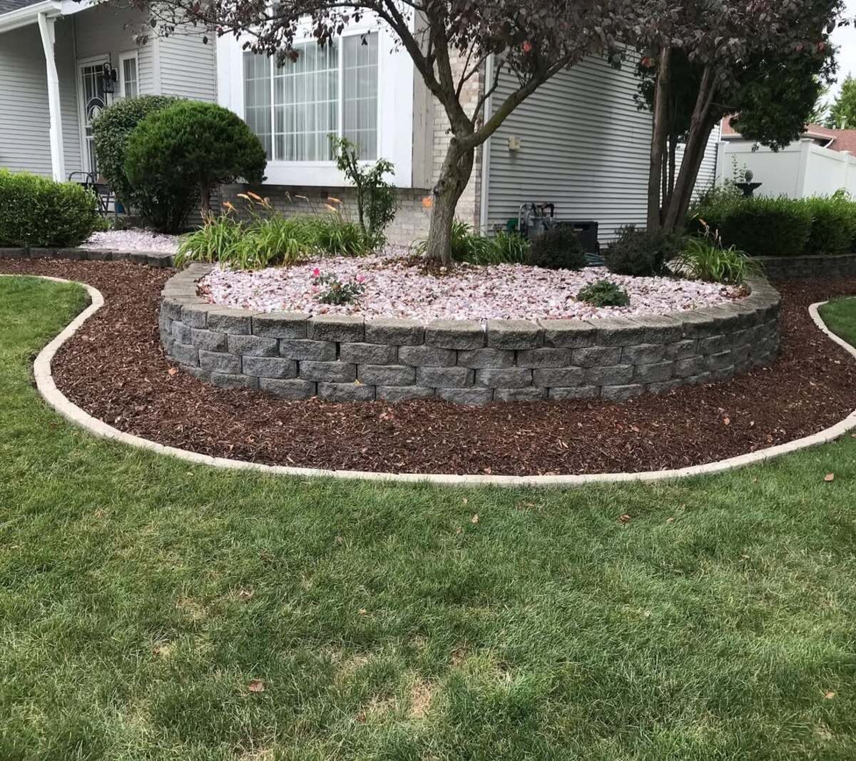 29 Brick Landscaping Ideas to Give Your Yard Timeless Charm 22 Multi Tiered Retaining Wall Ring
