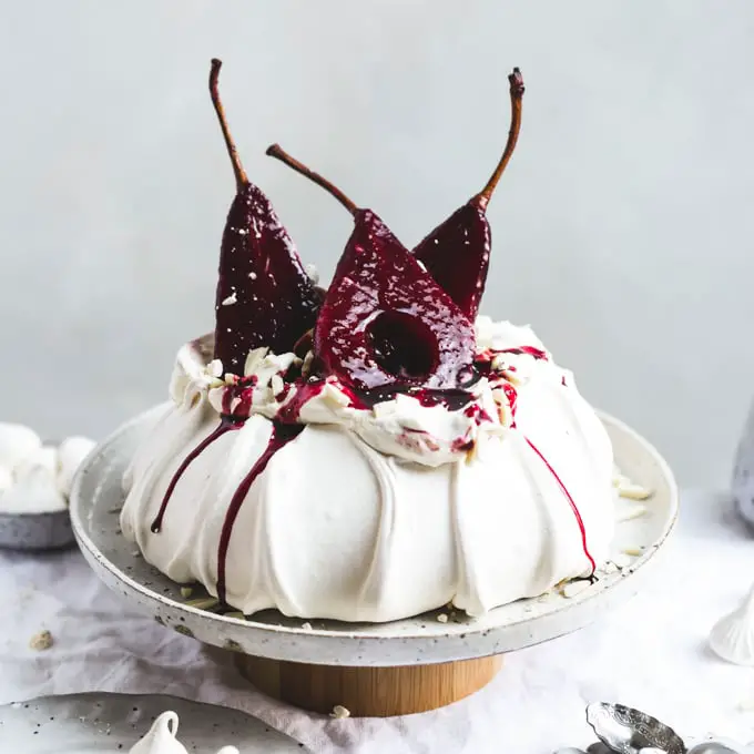 51+ Christmas Desserts Ideas for a Crowd 11 Red Wine Poached Pear Pavlova